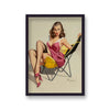 1960'S Inspired Pin Up Girl In Low Beach Chair Showing Black Stockings Beneath Pink Summer Dress