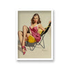 1960'S Inspired Pin Up Girl In Low Beach Chair Showing Black Stockings Beneath Pink Summer Dress